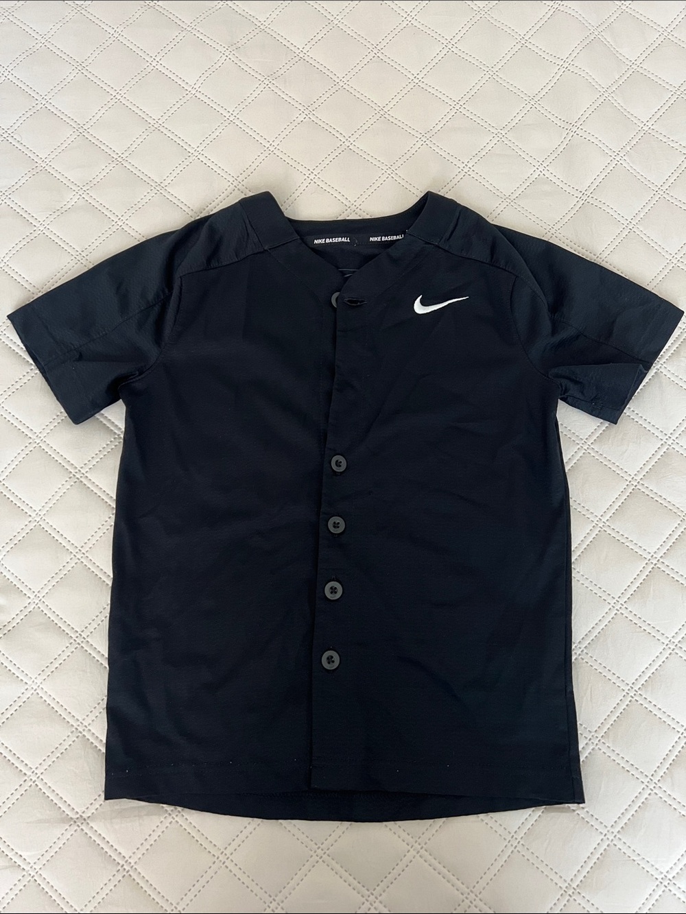 Kids Nike Black Short-Sleeve Button-Front Baseball Jersey with White Swoosh